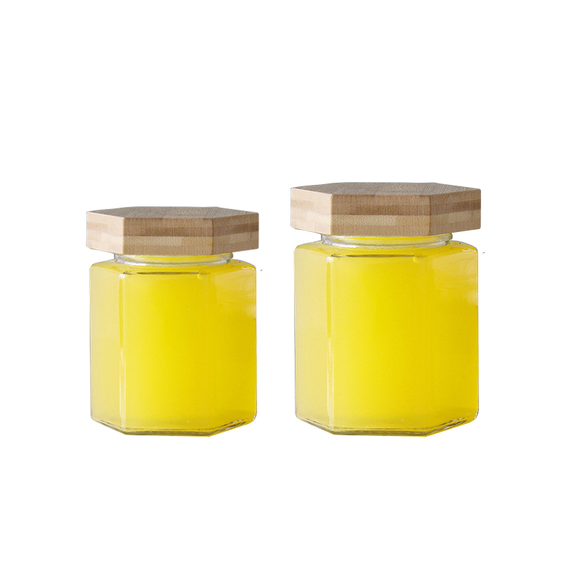 Tarro de vidro de mel transparente hexagonal con tapa de bambú3
