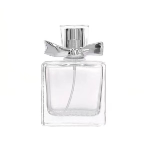 Botella de perfume de vidro transparente con tapón en forma de lazo 1